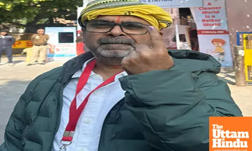 AAP candidate from Patparganj Assembly seat Awadh Ojha casts her vote for the Delhi Assembly Elections