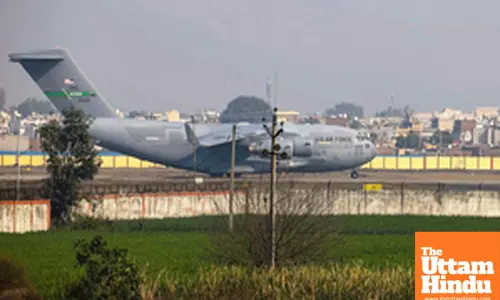 A U.S. military C-17 Globemaster III aircraft, carrying 104 deported Indian nationals lands at Shri Guru Ramdas Ji International Airport