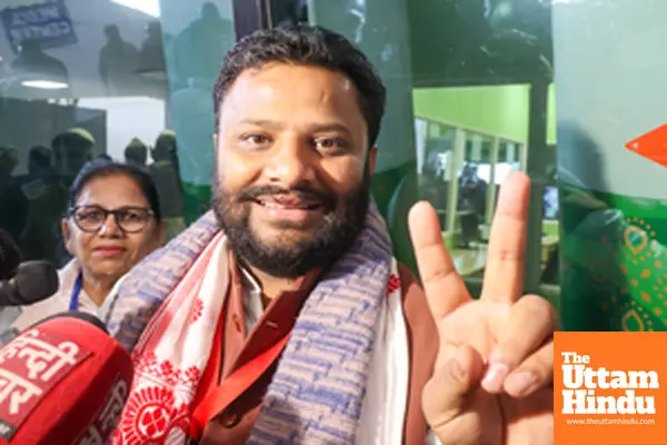 AAP candidate Kuldeep Kumar celebrates after his win in the Delhi Elections