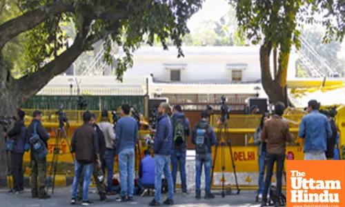 Media personnel outside the residence of AAP National Convener Arvind Kejriwal