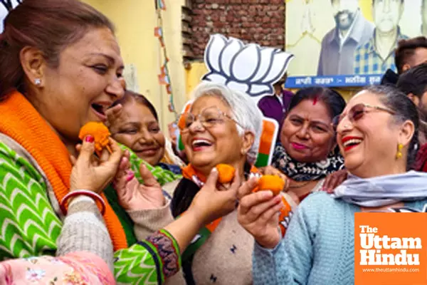 BJP workers celebrate the partys victory in the Delhi Assembly elections
