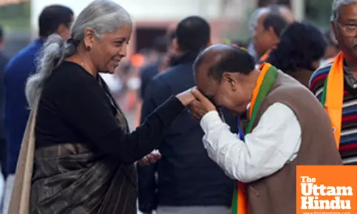 Union Finance Minister Nirmala Sitharaman is greeted by party leader Om Prakash Sharma at BJP headquarters