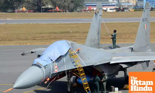 Fighter jets and other aircraft at the static display area at Yelahanka Air Force Station on the eve of Aero India 2025
