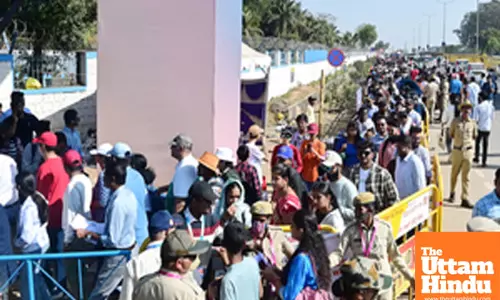 People stand in line to enter Aero India 2025 on Day 4 at Yelahanka Air Force Station