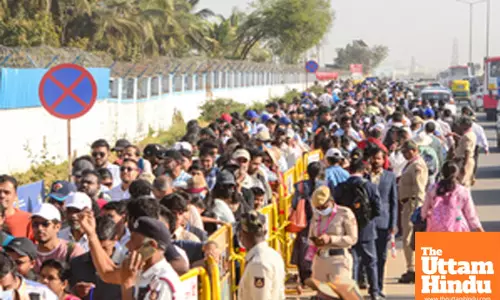 People stand in line to enter on the last day of Aero India 2025 at Yelahanka Air Force Station