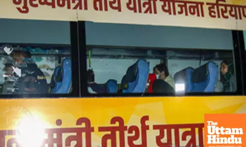A bus carrying deported Indians from the US leaves the airport