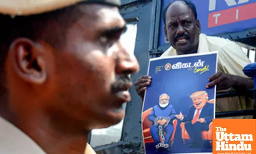 Members of CPI-M stage a protest against the central government