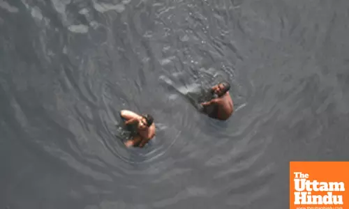 Children take a bath in the Yamuna River