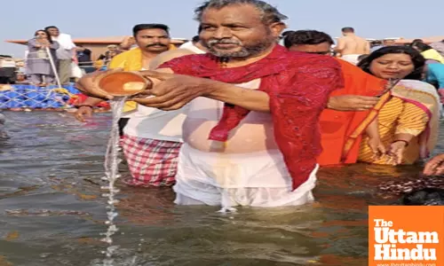 Jharkhand State BJP President Babulal Marandi takes a holy dip at Triveni Sangam
