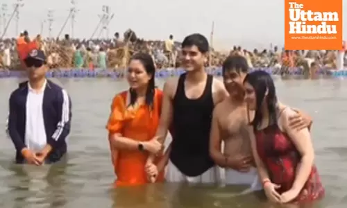 Assam CM, family take holy dip at Sangam