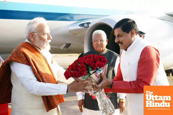 Madhya Pradesh CM Mohan Yadav presents a flower bouquet to PM Modi upon his arrival Madhya Pradesh CM Mohan Yadav presents a flower bouquet to PM Modi upon his arrival