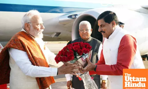 Madhya Pradesh CM Mohan Yadav presents a flower bouquet to PM Modi upon his arrival