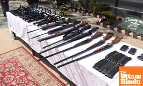 Security forces display arms and ammunition at Singjamei Chinga Mathak