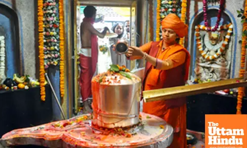 Mahant of Mankameshwar Temple, Divya Giri, offers prayers to Lord Shiva
