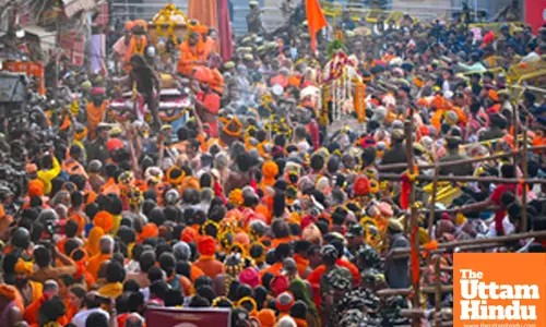 Naga sadhus and holy men take part in a procession towards Kashi Vishwanath Temple