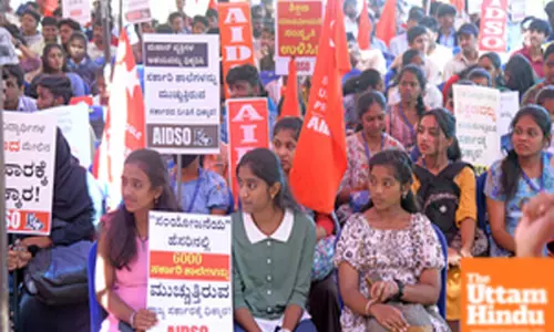 Members of AIDSO protest against the state government