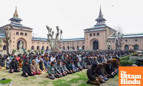 Muslims offer prayers during the first Friday of the fasting month of Ramadan