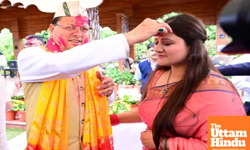 Title : Dehradun: Uttarakhand CM Pushkar Singh Dhami celebrates Holi