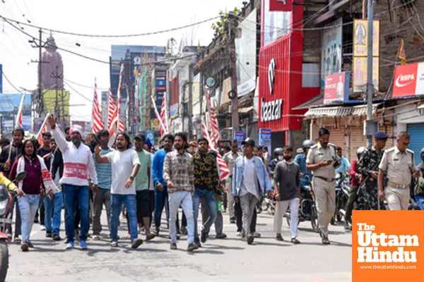 Title : Ranchi: People from the tribal community take out a protest march