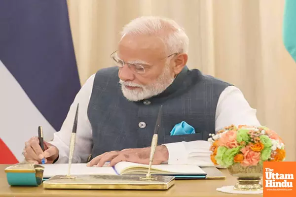 PM Modi signs visitors book PM Modi signs visitors book
