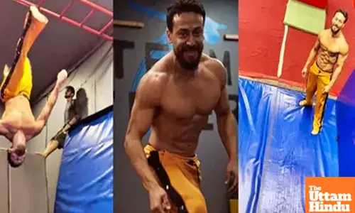 Tiger Shroff shows off his strength while carrying 80+ kgs of muscle