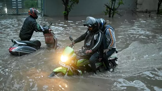 Heavy rain disrupts life in Delhi; flights affected, IMD issues red alert Heavy rain disrupts life in Delhi; flights affected, IMD issues red alert