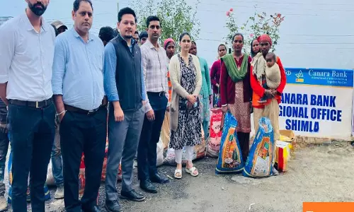 Canara bank officers’ association distributes relief kits to calamity-affected families