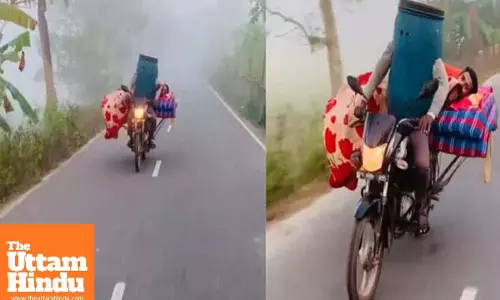 Desi Hack to Beat the Cold: Man Rides Bike Wearing a Plastic Drum, Friend Sleeps on Cot Behind; Video Goes Viral